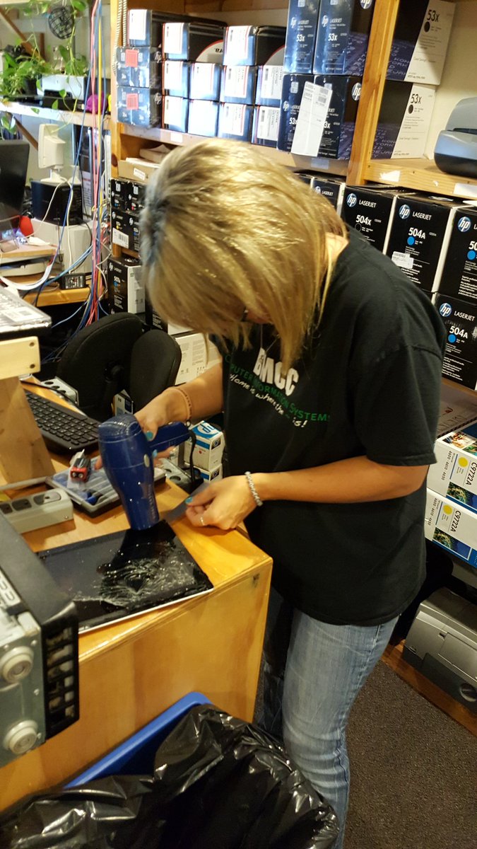 Student fixing an iPad screen